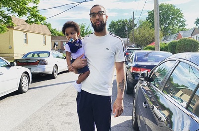 Maurice Howerton and Son standing outside